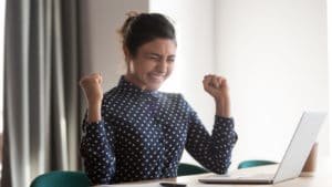 excited employee receives a promotion recommended by an HR consultant