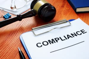 Compliance form and gavel - employment law compliance