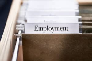 employment folder with hiring and onboarding records for HR compliance