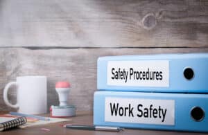 binders containing safety procedures and workplace safety documents
